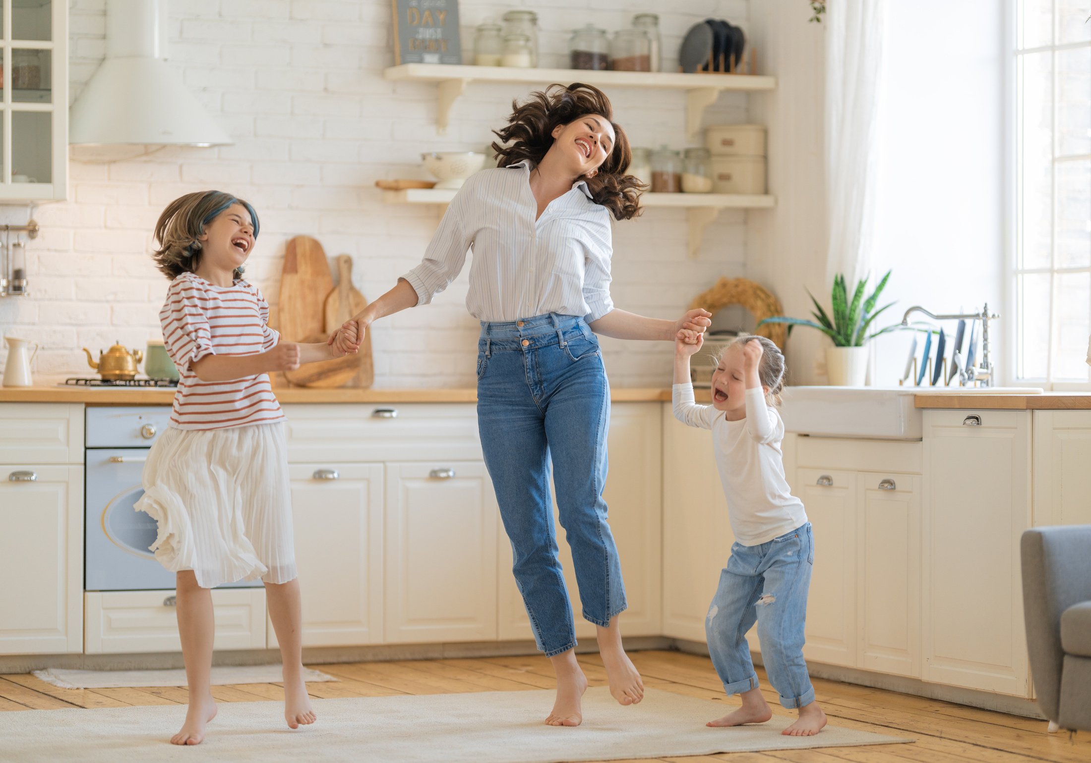 Mom and Her Daughters Are Dancing.